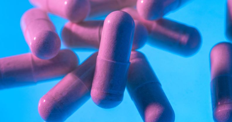 pink pills on a blue background