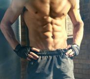 shirtless man in the gym
