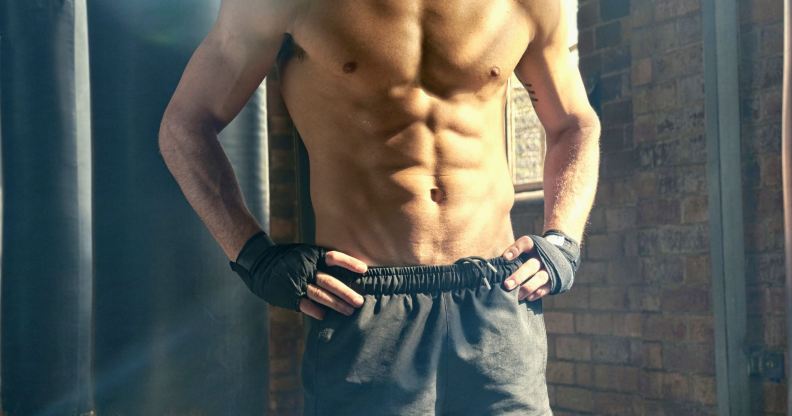 shirtless man in the gym