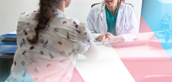 a woman speaks with a doctor