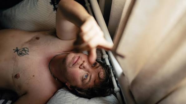 Sweet Milk Lake: a person lying in bed looking up at the ceiling