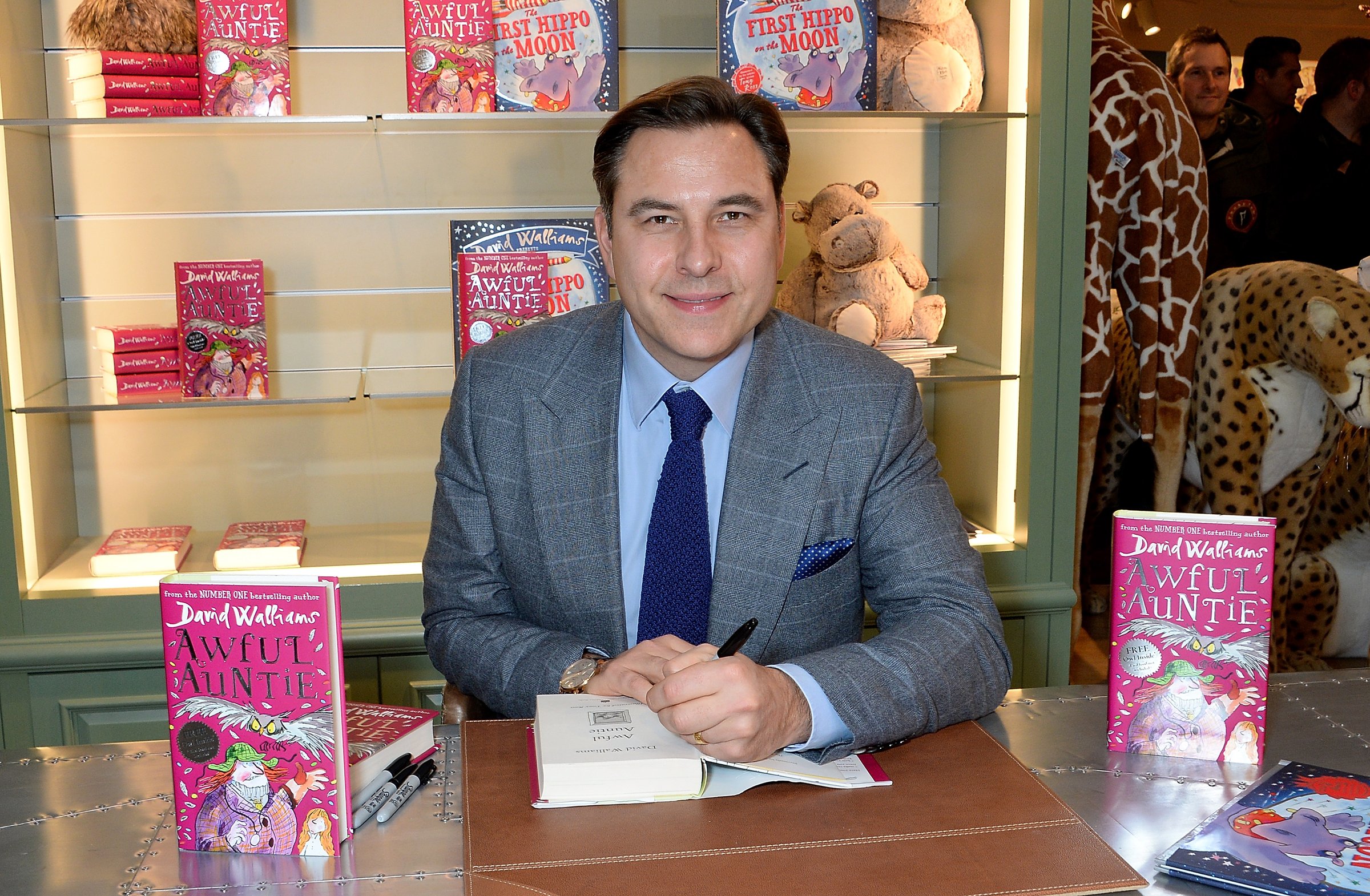 LONDON, ENGLAND - DECEMBER 06: David Walliams signs new children's book 'Awful Auntie' and his new picture book, 'The First Hippo on the Moon' at Harrods on December 6, 2014 in London, England. (Pho
