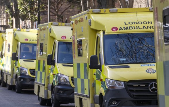 Several ambulances driving through London.