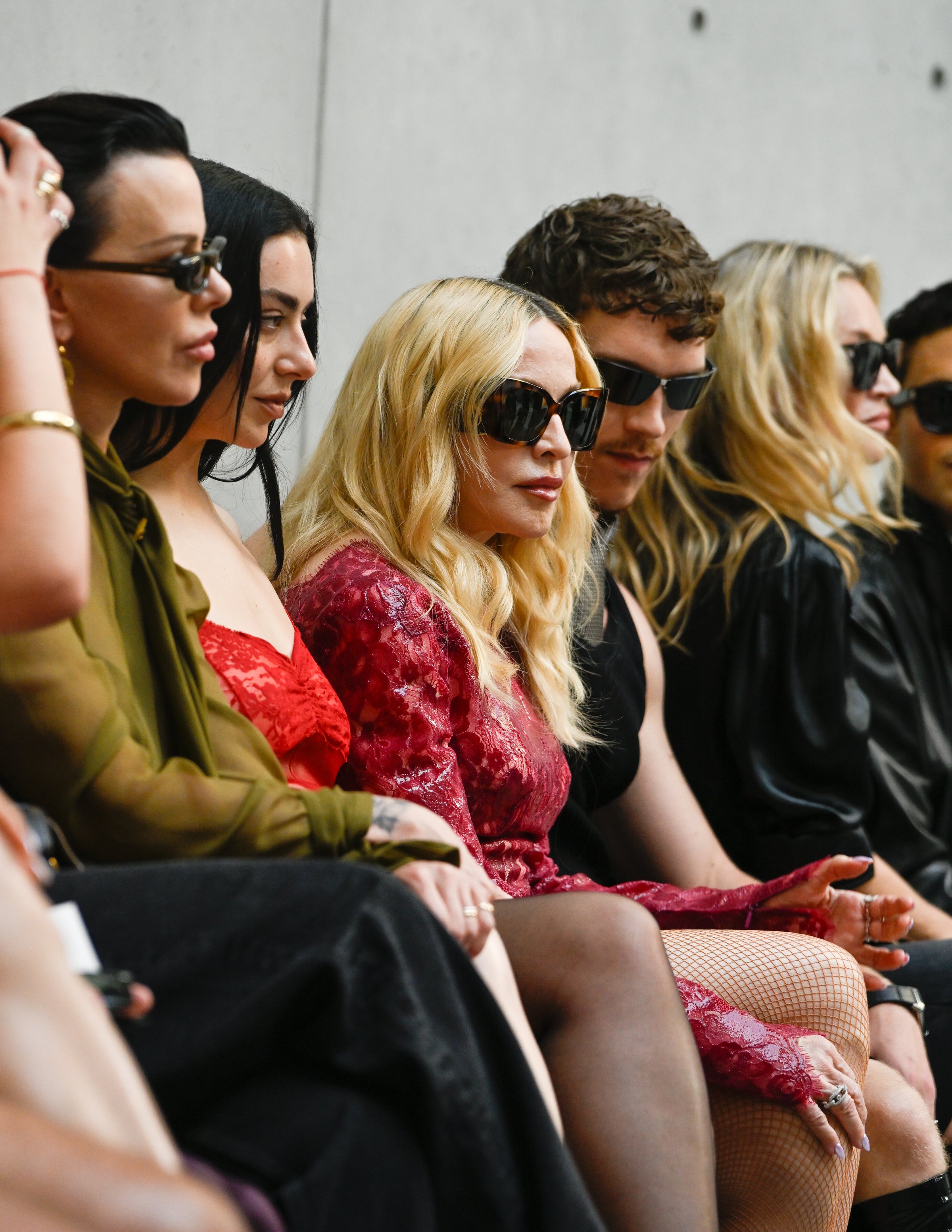 Debi Mazar, Charli xcx, Madonna, Connor Storrie and Kate Moss at the Saint Laurent fashion show as part of Paris Men's Spring-Summer 2027 fashion week held at Bourse de Commerce on June 23, 2026 in Pa
