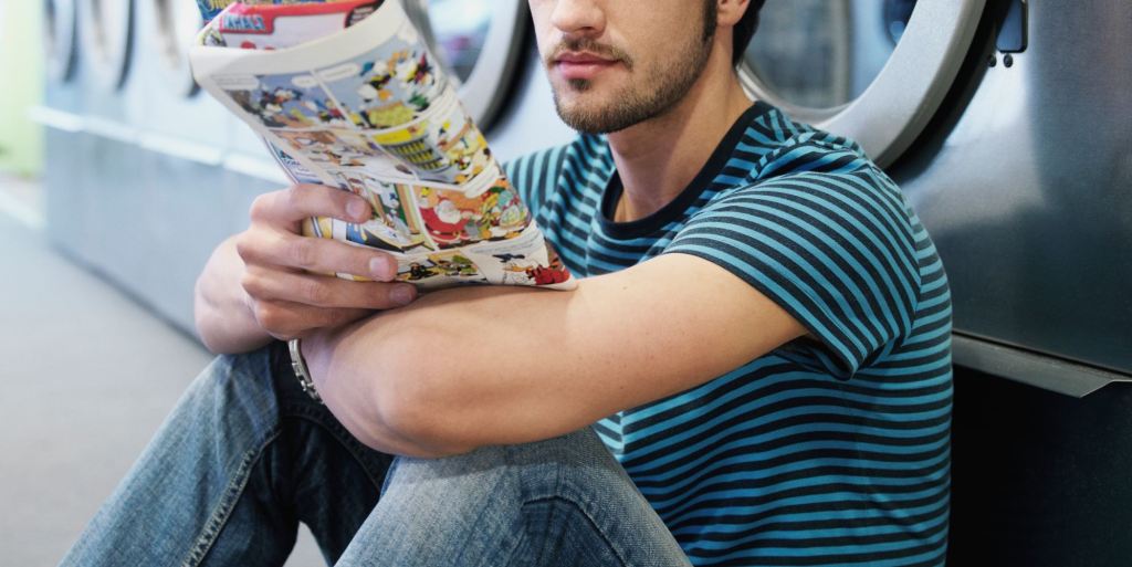 A man reading a comic book