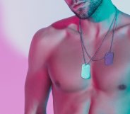 A shirtless model poses for a portrait