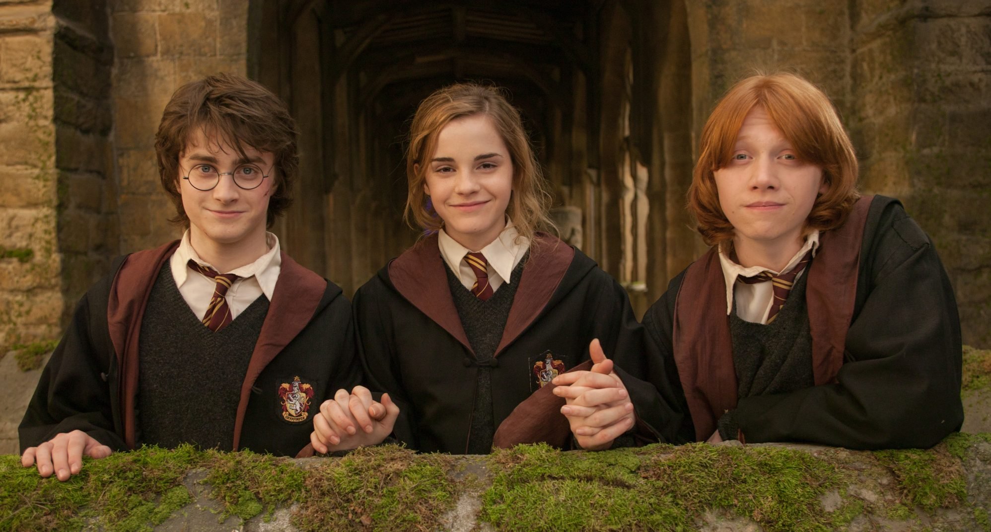 Actors, Daniel Radcliffe, (L) Emma Watson (M) and Rupert Grant (R) on the set of the film, ‘Harry Potter and The Goblet of Fire’, London, England, 2005 (Photo by Murray Close/ Getty Images)
