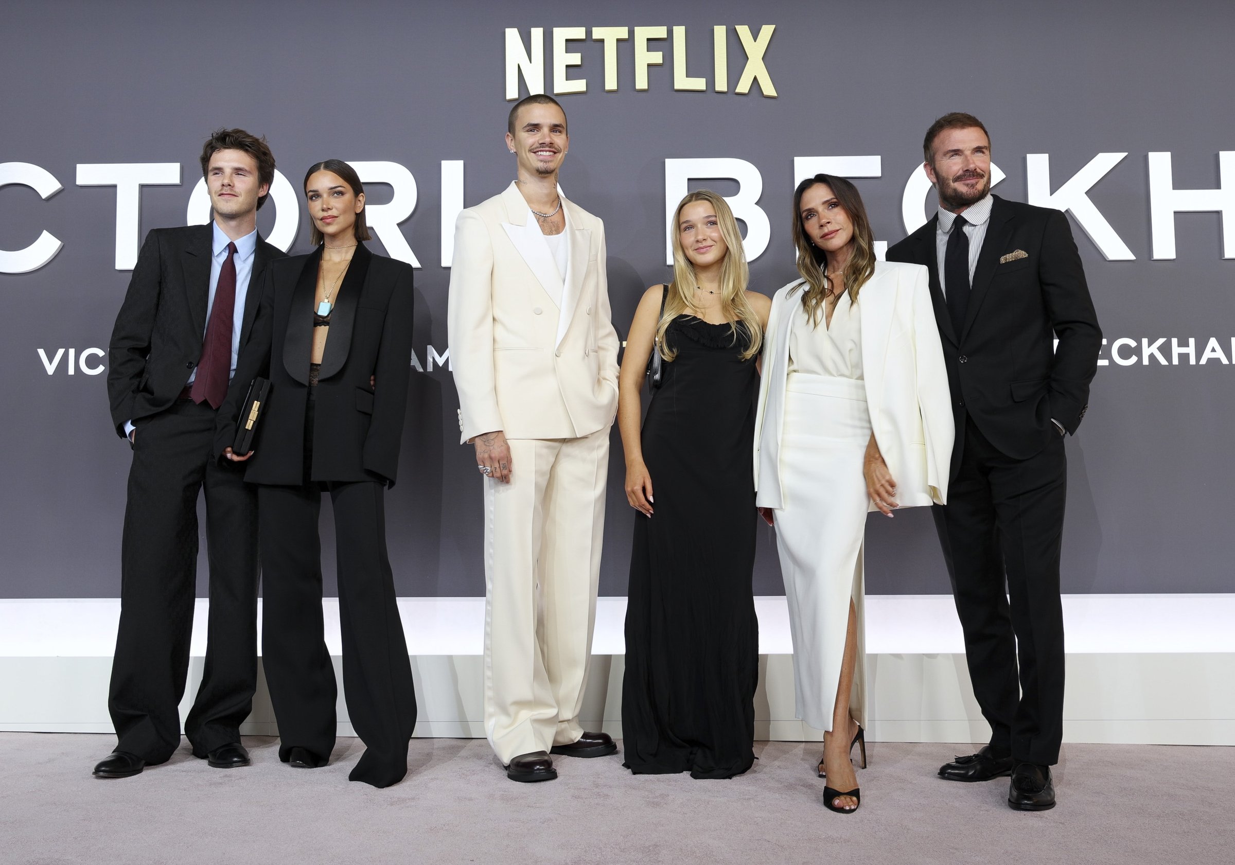 LONDON, ENGLAND - OCTOBER 08: Cruz Beckham, Jackie Apostel, Romeo Beckham, Harper Beckham, Victoria Beckham and David Beckham attend the
