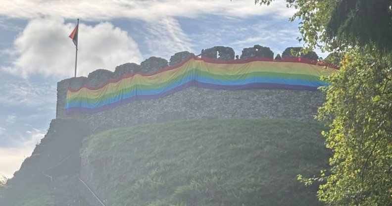 Totnes Castle wrapped in a giant Pride flag
