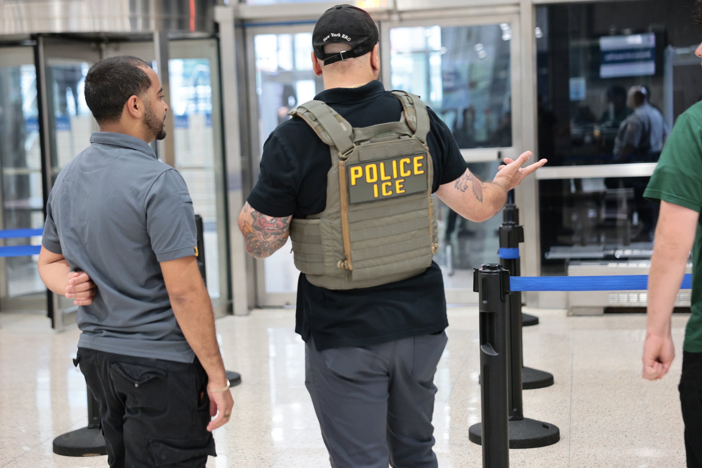 NEW YORK, NEW YORK - SEPTEMBER 01: Immigration and Customs Enforcement stand guard outside of their NY field office on September 01, 2026 in New York City. Secretary of Homeland Security Markwayne Mul