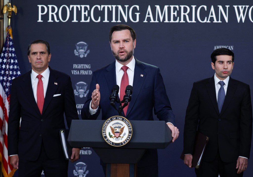 Vice President JD Vance (C) speaks as U.S. Attorney General Todd Blanche (L) and U.S. Labor Secretary Keith Sonderling listen during a Fraud Task Force press conference