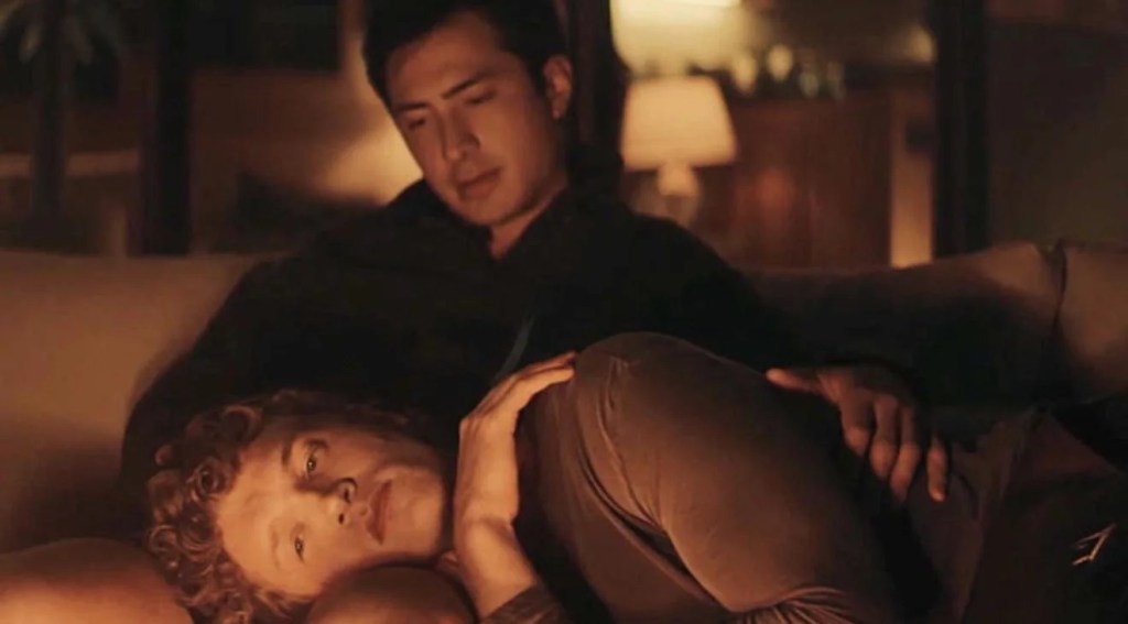 Heated Rivalry: Ilya lying in Shane's lap by the fire