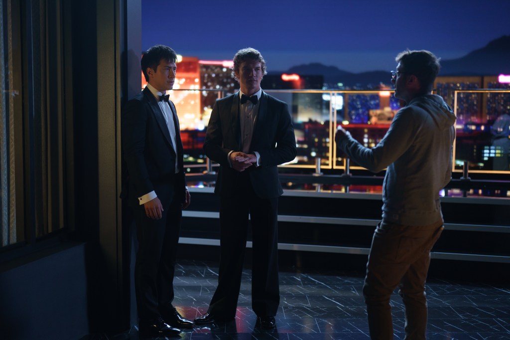 Heated Rivalry (L to R) - Hudson Williams as Shane Hollander, Connor Storrie as Ilya Rozanov and Jacob Tierney (writer/director) in BTS episode 101 of Heated Rivalry.