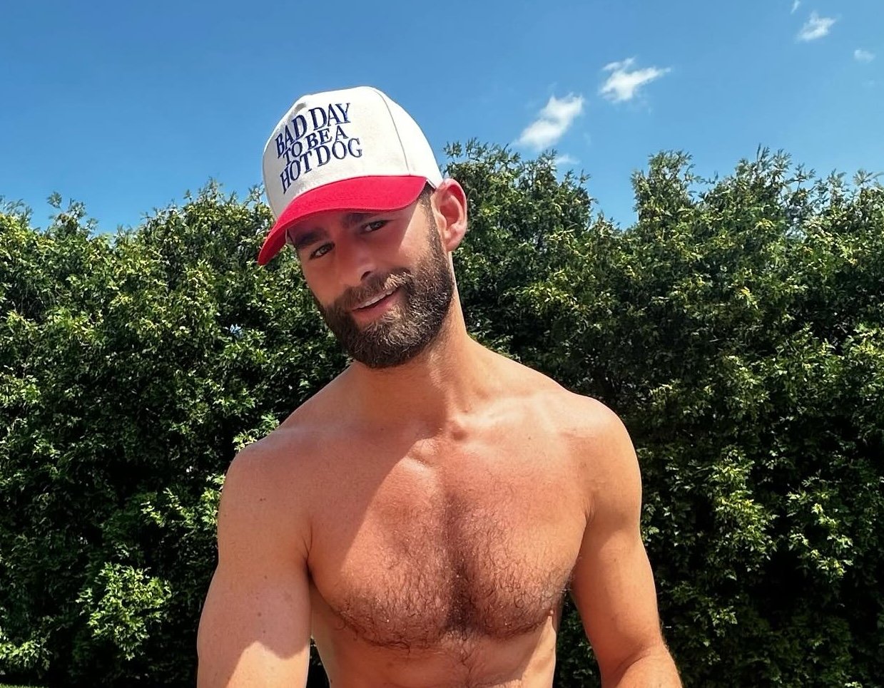Chris Salvatore in a garden wearing a hat