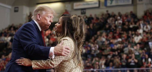Nicki Minaj greets Donald Trump during a campaign rally in Michigan on 25 October