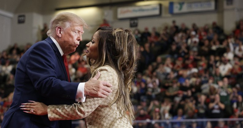Nicki Minaj greets Donald Trump during a campaign rally in Michigan on 25 October