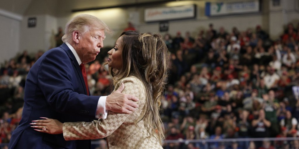 Nicki Minaj greets Donald Trump during a campaign rally in Michigan on 25 October