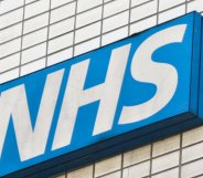 A skewed shot of an NHS sign.