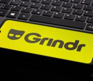 In this photo illustration, the Grindr logo is seen displayed on a smartphone screen