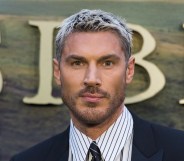 Chris Appleton in a dark suit and pinstripe shirt