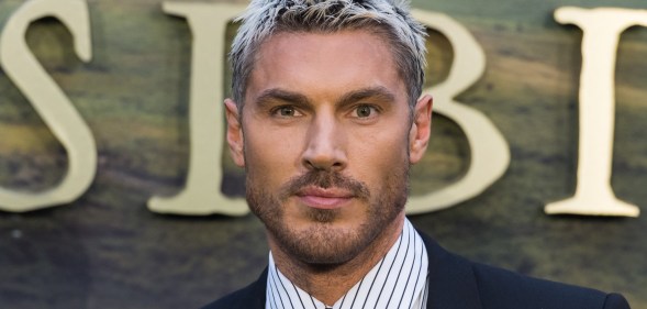 Chris Appleton in a dark suit and pinstripe shirt