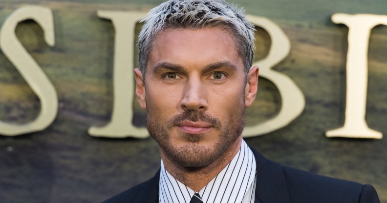 Chris Appleton in a dark suit and pinstripe shirt