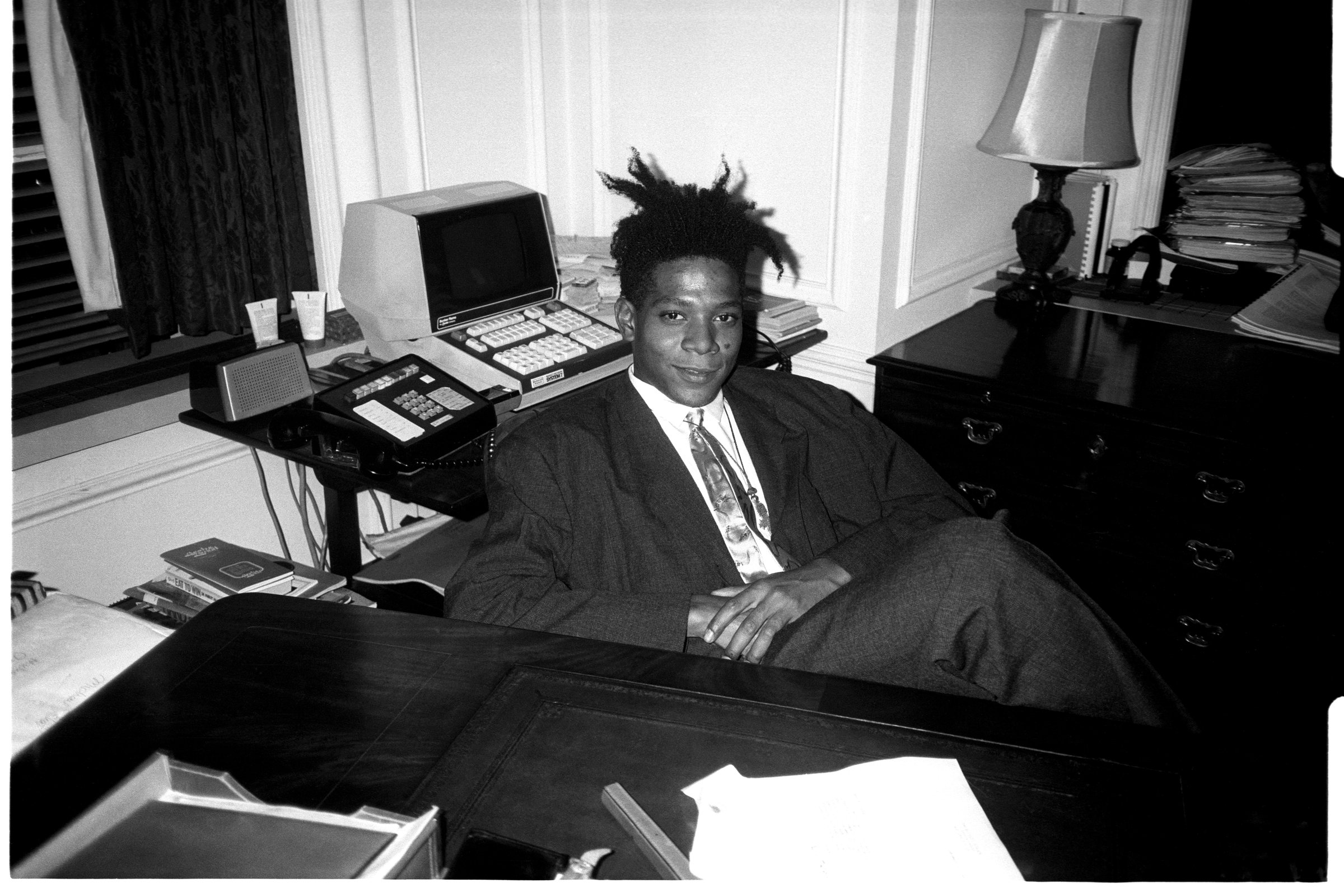 Jean - Michel Basquiat at the surprise birthday party for Susanne Bartsch at the Rainbow Roof, at Steven Greenberg's office, 30 Rockefeller Plaza. Thursday, September 19, 1985. (Photo by Patrick McMul