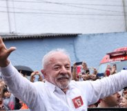 SAO PAULO, BRAZIL - OCTOBER 25: Luiz Inácio Lula Da Silva, incumbent president of Brazil and presidential candidate waves supporters after casting his vote during general election day on October 25, 2
