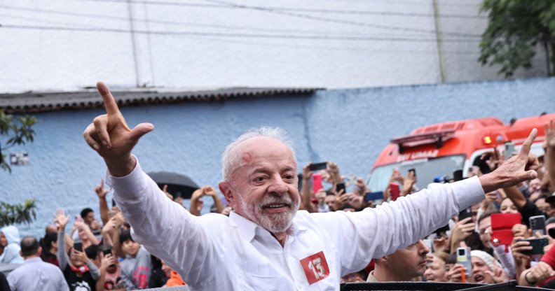 SAO PAULO, BRAZIL - OCTOBER 25: Luiz Inácio Lula Da Silva, incumbent president of Brazil and presidential candidate waves supporters after casting his vote during general election day on October 25, 2