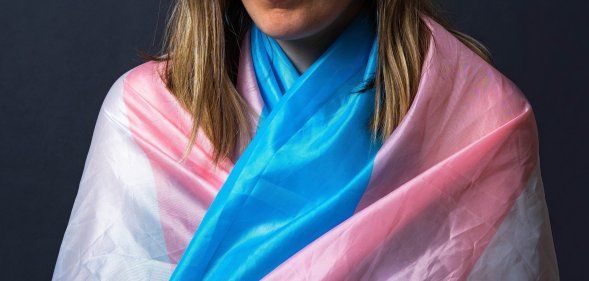 Person wearing a trans Pride flag