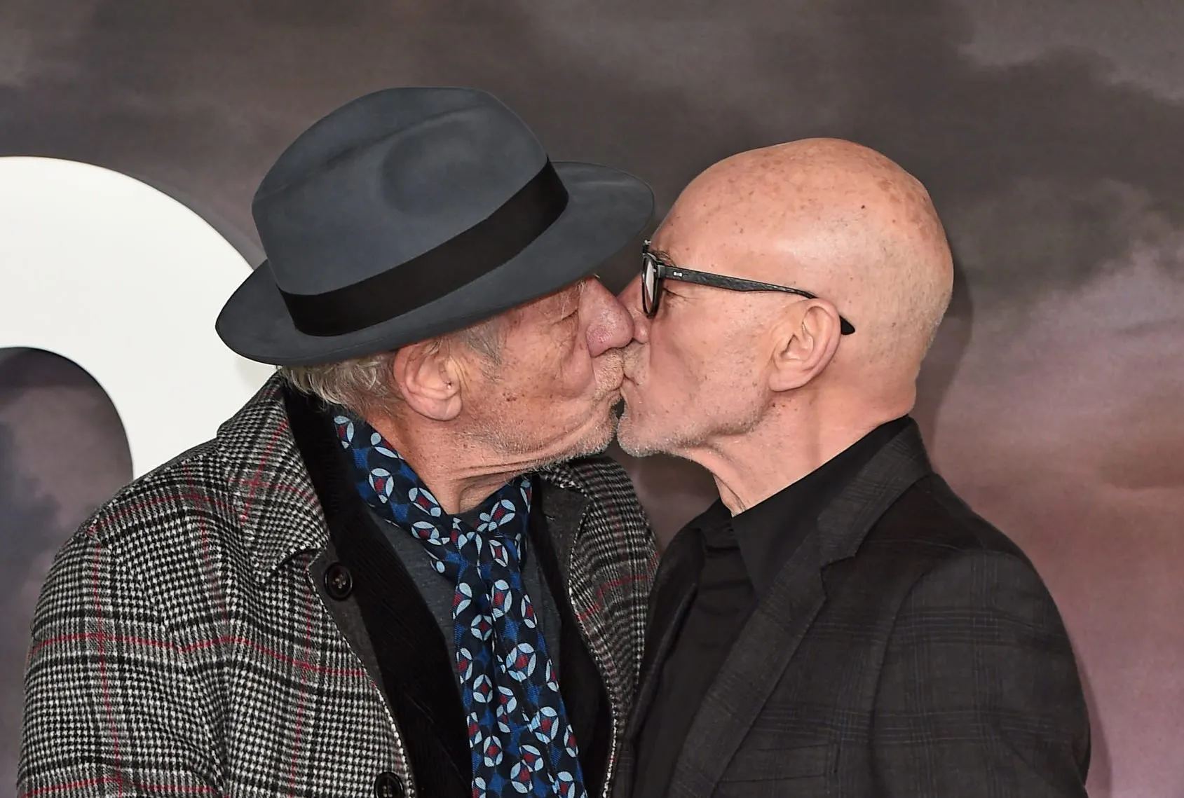 Ian McKellen and Patrick Stewart kiss on the red carpet and we are so full of emotion right now. (Eamonn M. McCormack/Getty Images)