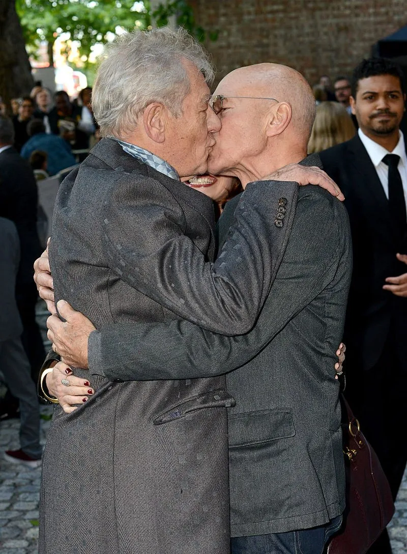 Sir Ian McKellen and Sir Patrick Stewart kissing at the UK premiere of Mr Holmes in 2015