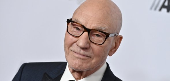 Sir Patrick Stewart wearing glasses and a dark suit at the American Cinematheque Awards