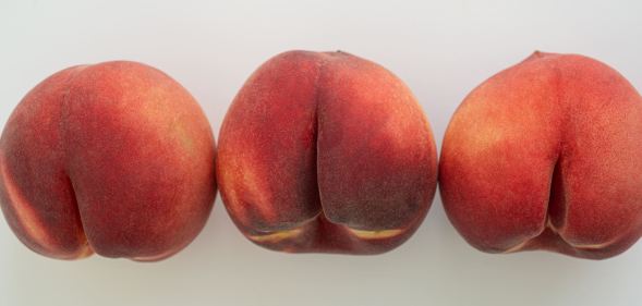 three peach fruits