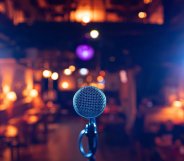Microphone Stands Ready on Stage in Dimly Lit Bar