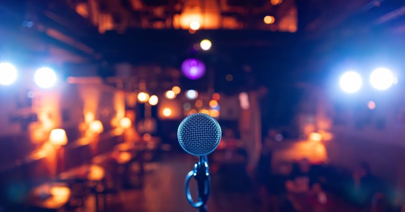 Microphone Stands Ready on Stage in Dimly Lit Bar