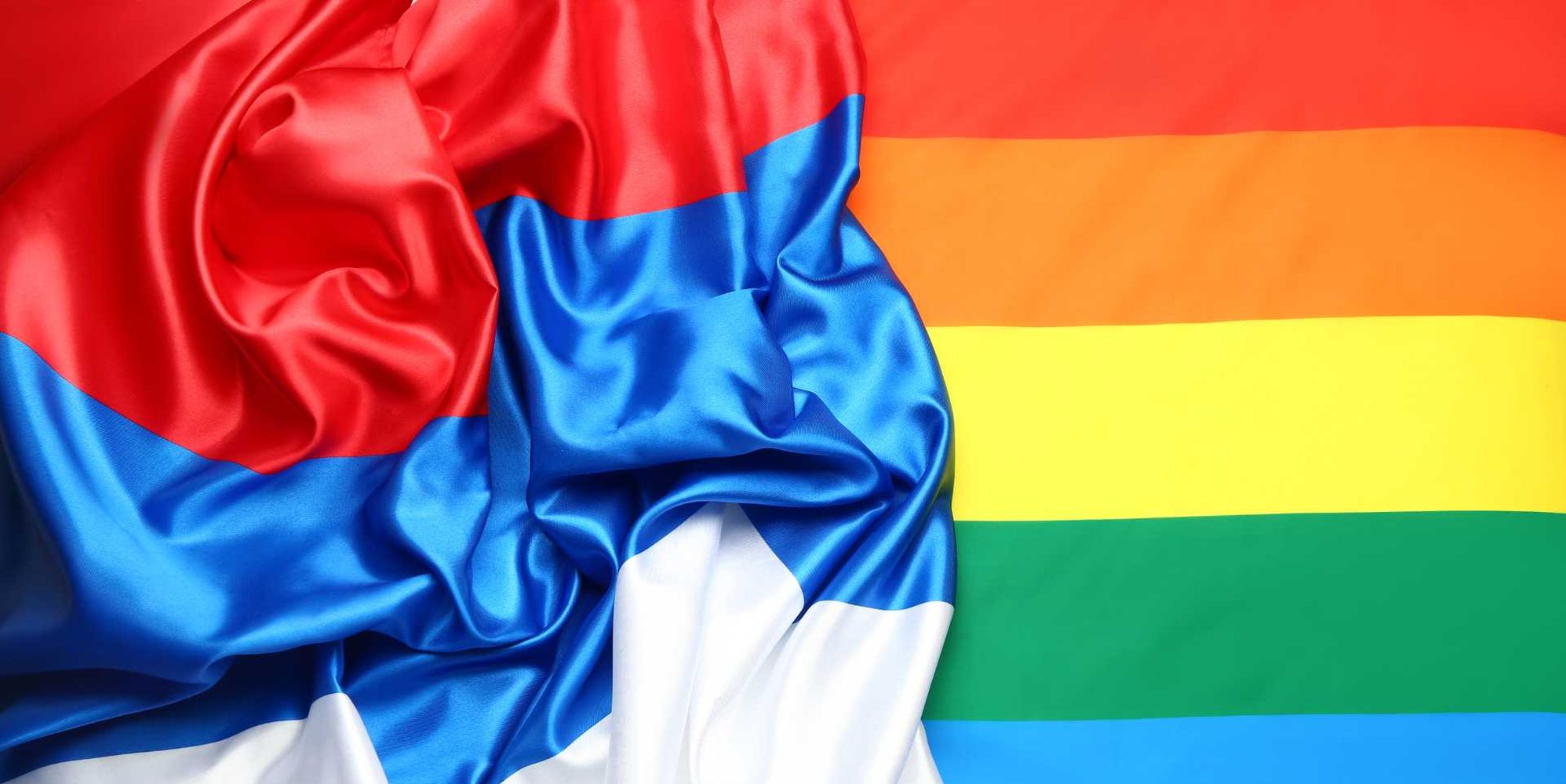 Russian flag next to rainbow Pride flag